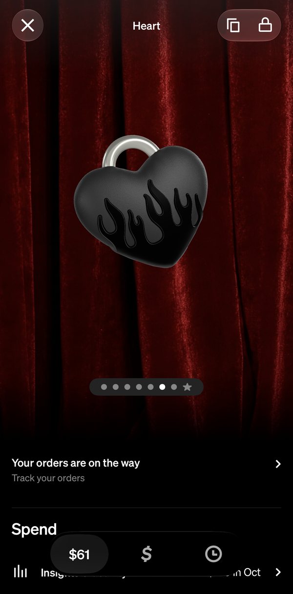 The Cardware tab on the black Heart tag, over a red velvet curtain: under the tag, one row reads Your orders are on the way, Track your orders