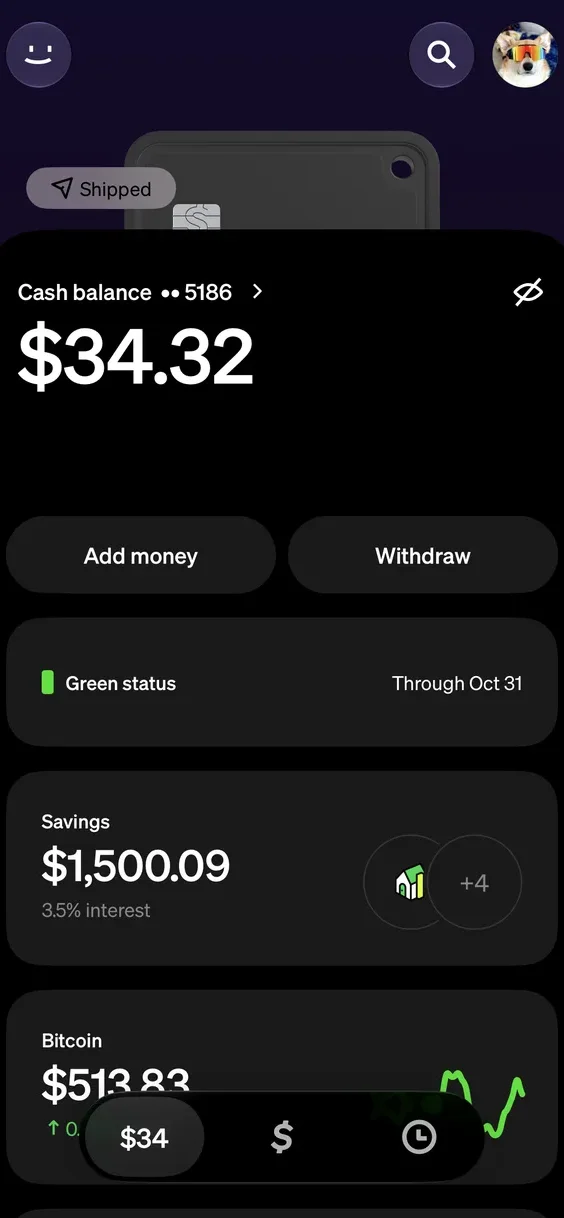 The Money tab with a black card on its way: a Shipped pill on the card above the balance
