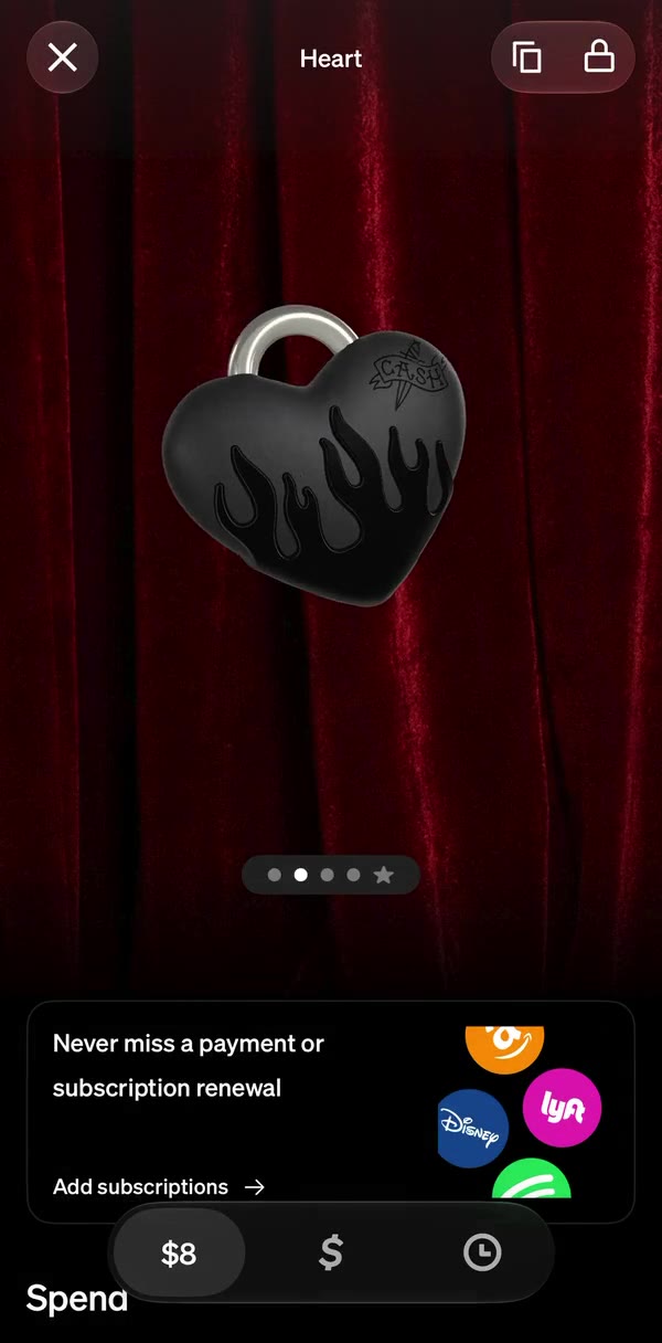 The Cardware tab: the Heart in 3D against red velvet, with copy and lock, and Spending below