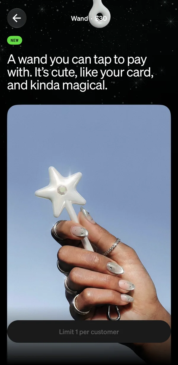 Scrolling the Wand's page: a photo of a hand holding the pearl star wand against the sky