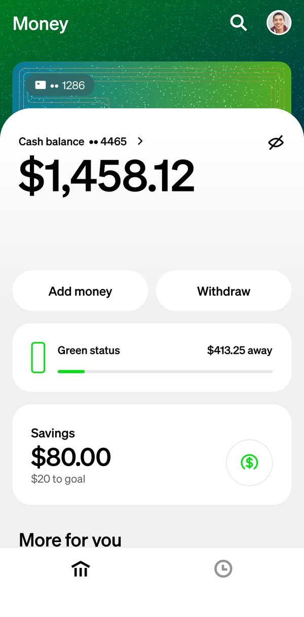 The Money tab themed by the green glitter card: the header and the card peeking above the balance take on its material